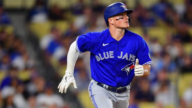 Jul 24, 2023; Los Angeles, California, USA; Toronto Blue Jays third baseman Matt Chapman (26) hits a solo home run against the Los Angeles Dodgers during the eighth inning at Dodger Stadium. Mandatory Credit: Gary A. Vasquez-USA TODAY Sports